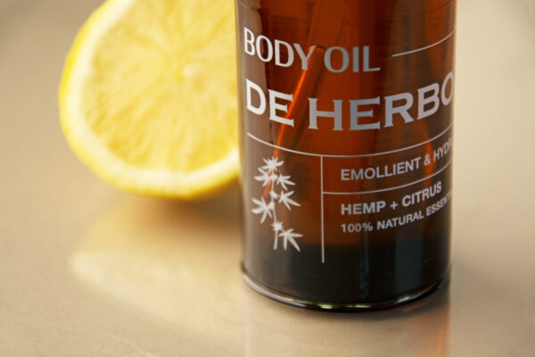 shot of hydrating body oil with citrus oil and hemp seed oil